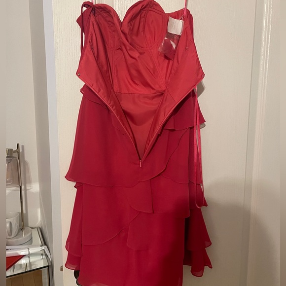 Dress never worn. 

Color: bright pink. 

Comes with removable straps. - Picture 3 of 6